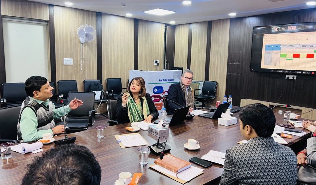 Regulators gather in a room to discuss 100 Day Mission readiness